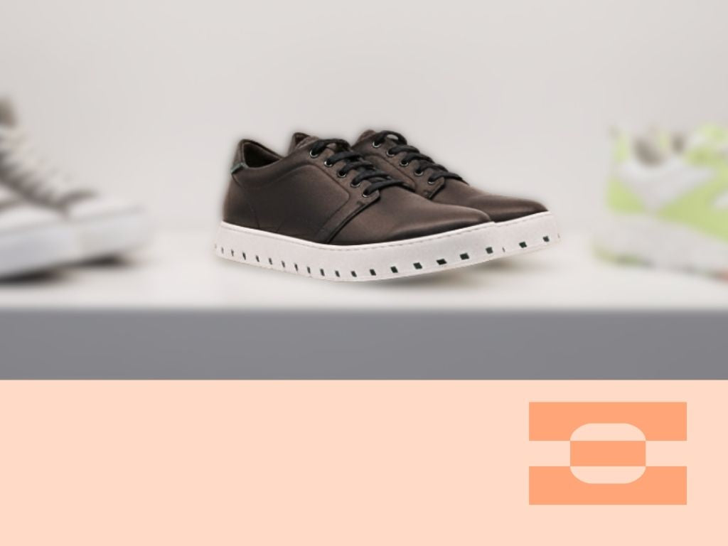 IAMBIC MODEL T precision-fit shoe on display among contemporary sneakers