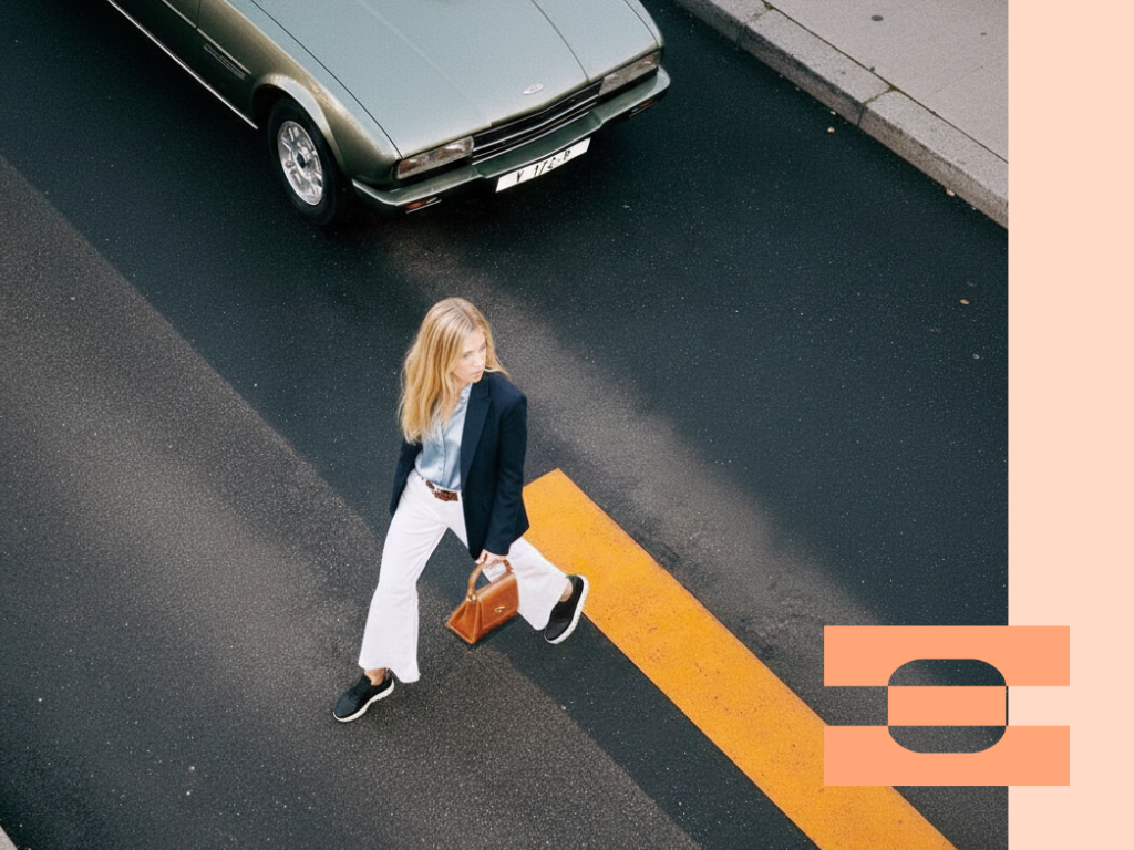 Overhead street shot of an executive crossing the road in IAMBIC MODEL T precision-fit sneakers for all-day comfort