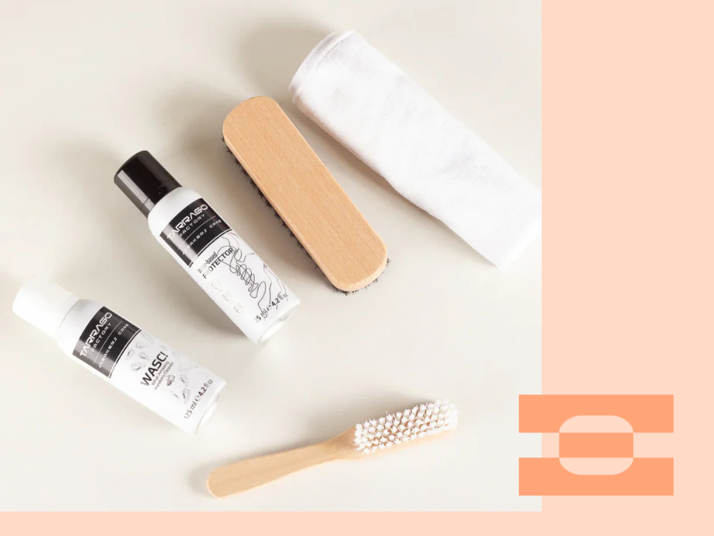 IAMBIC Complimentary Luxury Shoe Care Kit tools on a desk