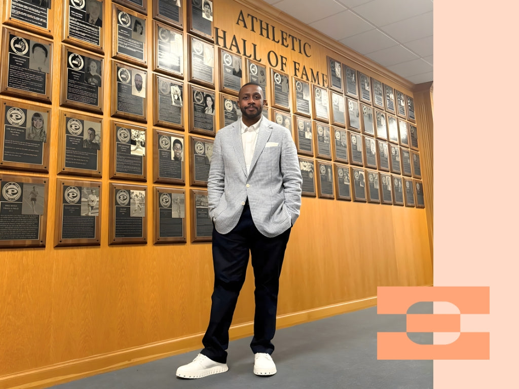 Al Boatright, Division One basketball executive, wearing IAMBIC MODEL T precision-fit shoes in the Athletic Hall of Fame, representing leadership, performance, and modern footwear innovation.