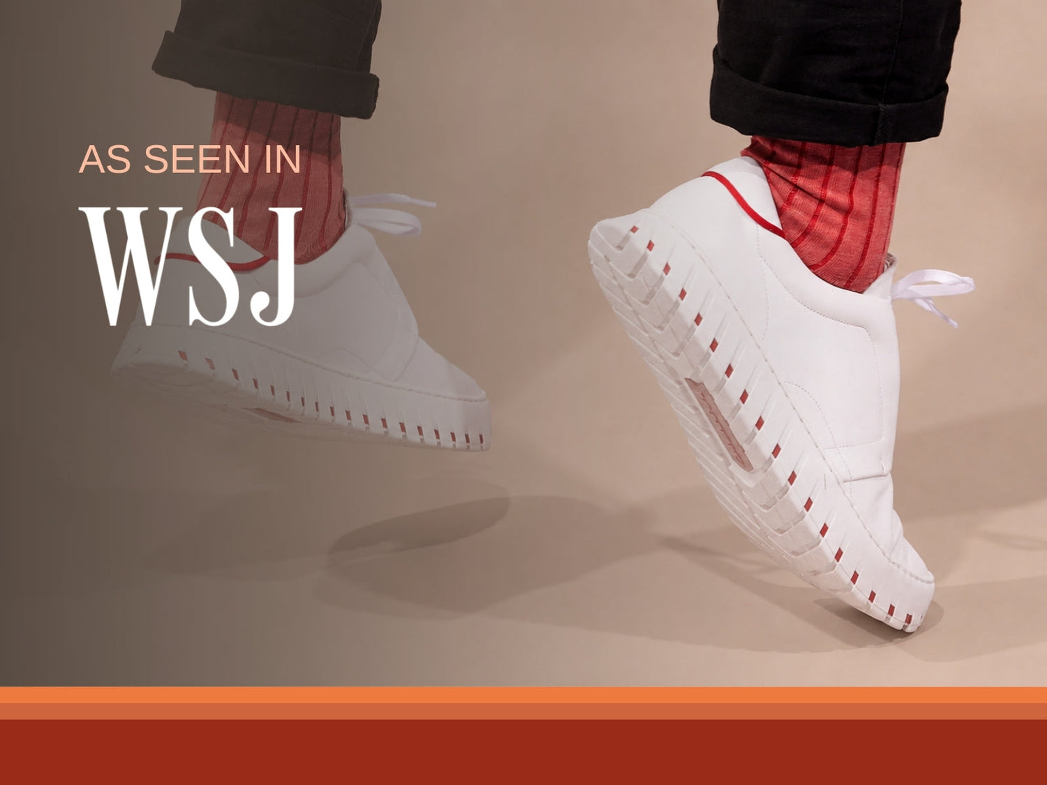 White IAMBIC precision-fit shoes mid-stride on a peach field, from The Wall Street Journal feature