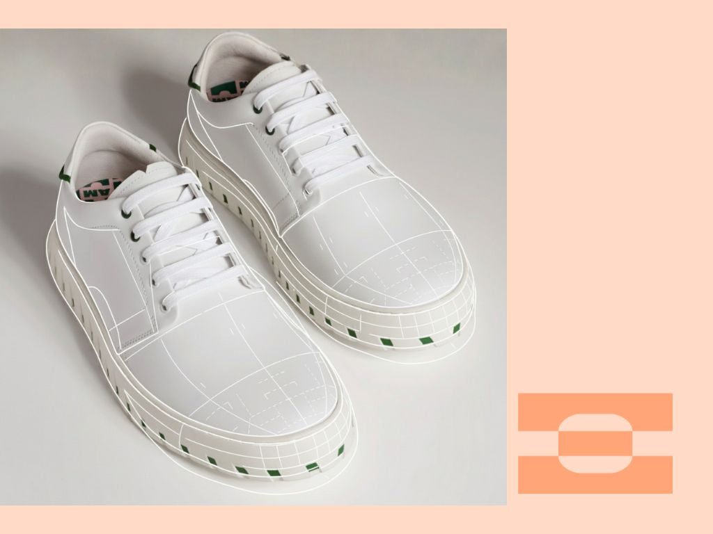 IAMBIC MODEL T custom-fit white leather shoes overlaid with digital blueprint lines, symbolizing precision engineering and long-lasting craftsmanship beyond luxury footwear.