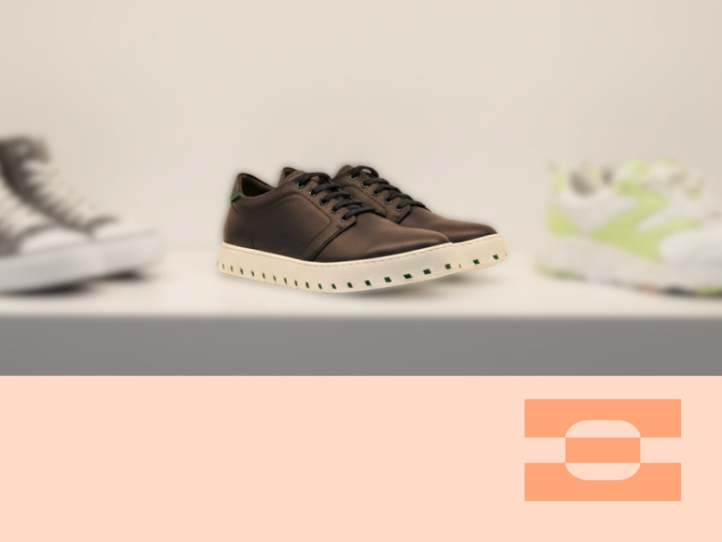 IAMBIC MODEL T precision-fit shoe on display among contemporary sneakers